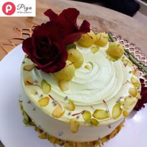 Rasmalai cake with rose on top